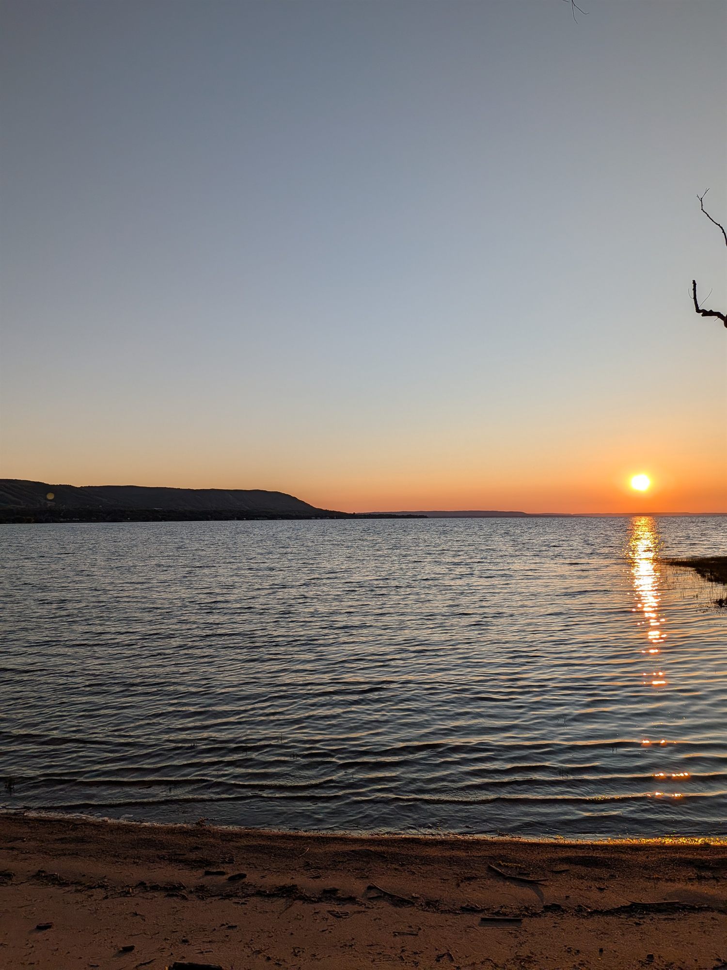 Late sunset over the bay with the private beach in the foreground